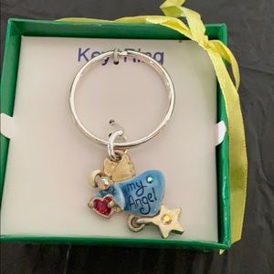 Key Chain that features dangling angel